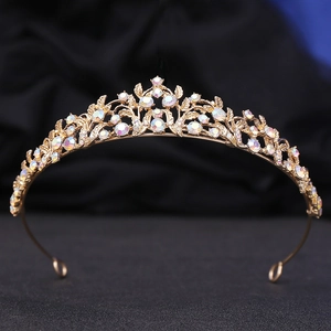Detailed macro view of golden leaf crown with iridescent AB crystals for bridal wear