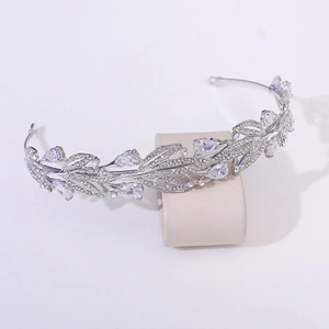 Detailed macro view of silver leaf bridal crown with pear-shaped rhinestones