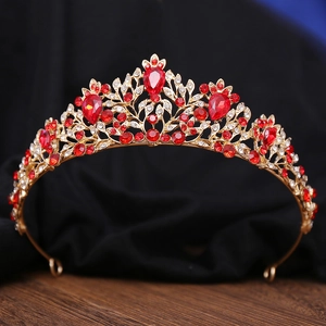 Detail of red crystals and gold alloy base on a Baroque style bridal tiara