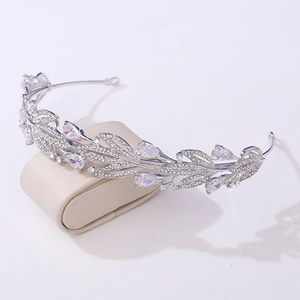 Macro detail of bridal leaf crown featuring sparkling cubic zirconia on a display stand