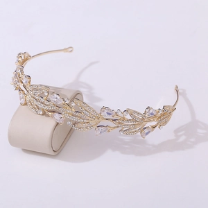 Detailed macro view of the golden leaf bridal crown with crystal rhinestones