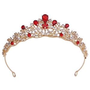 Front view of Baroque golden crown with red pear-cut rhinestones and crystal details
