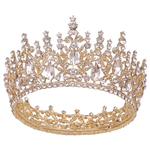 Close-up of golden baroque tiara with marquise crystals and rhinestones for weddings