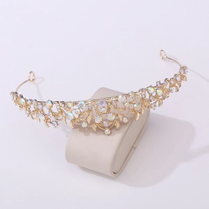 Detail showing the intricate hollow gold metalwork and AB rhinestones of the bridal crown