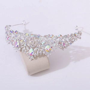 Detail of silver alloy bridal crown featuring colorful AB rhinestones and leaf patterns