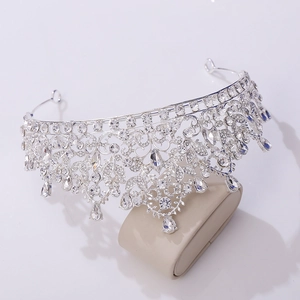 Macro detail of bridal crown with sparkling crystal teardrops on a display stand