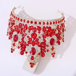 Detailed macro view of crystal wedding crown with large red pear-shaped gemstones