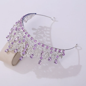 Close-up of luxury bridal crown with purple crystals and silver floral alloy details