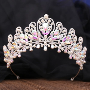 Luxury silver bridal crown with white pearls and iridescent crystals on black mesh