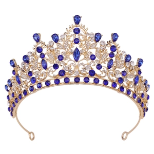 Macro view of gold alloy bridal crown with deep blue sapphire stones and clear crystals