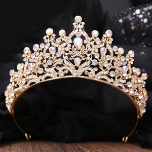 Elegant gold bridal crown with crystal leaf details and luxury baroque style rhinestones