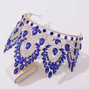 Detail of silver alloy tiara with royal blue teardrop crystals and white rhinestones