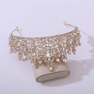 Detail of leaf pattern bridal crown with gold metalwork and sparkling AB rhinestones