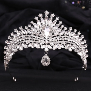 Elegant bridal crown with sparkling crystals and a teardrop pendant for wedding styling