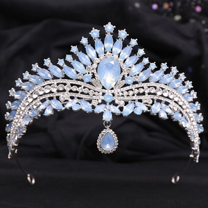 Detail of silver bridal crown with light blue cat eye stones and water drop pendant