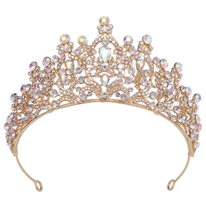 Close-up of golden bridal crown showing intricate leaf patterns and AB rainbow rhinestones