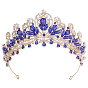 Luxurious gold bridal crown featuring royal blue crystals and white pearls for weddings