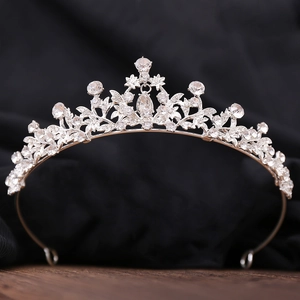 Macro shot of silver bridal tiara featuring marquise rhinestones and central pear-shaped gem