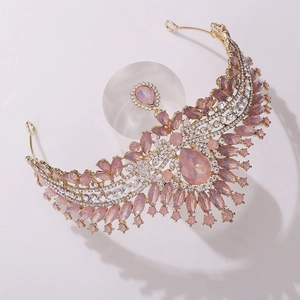Detailed view of pink crystal tiara with teardrop stones on a gold metal base