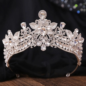 Macro detail of silver bridal tiara with floral rhinestones and teardrop crystal