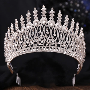 Macro shot of silver Baroque crown with intricate rhinestones and integrated hair comb base