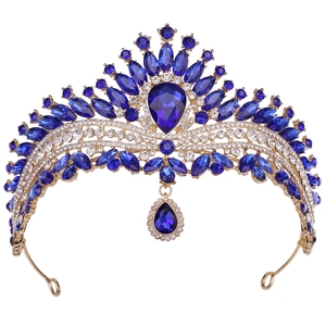 Luxury gold bridal crown with deep blue crystals and shimmering rhinestones for weddings
