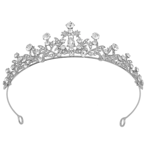 Detail of silver bridal tiara featuring vine patterns and sparkling rhinestones