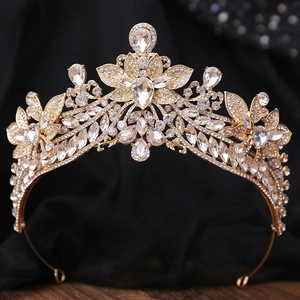 Detail of a bridal gold alloy crown featuring sparkling floral rhinestones and water drop stones