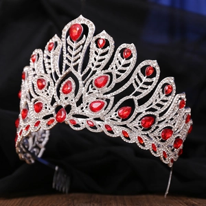 Detail of luxury pageant crown featuring red teardrop stones and silver alloy comb