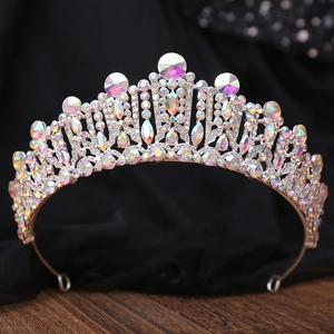 Detail of baroque bridal crown showing silver metal frame with colorful crystals