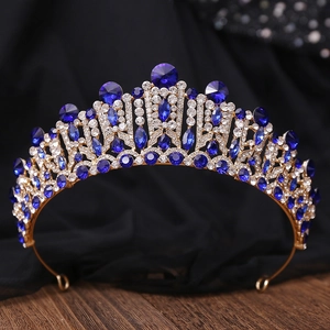Detailed view of Baroque gold bridal crown featuring dark blue crystals and rhinestones