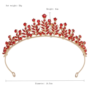 Detail view of gold alloy crown with red crystals showing 58g weight and 4cm height