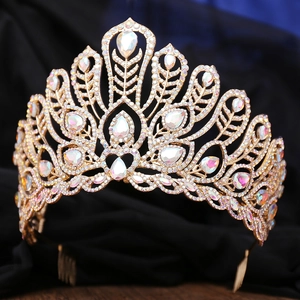 Detailed view of golden beauty pageant crown with pear-shaped rhinestones and side combs