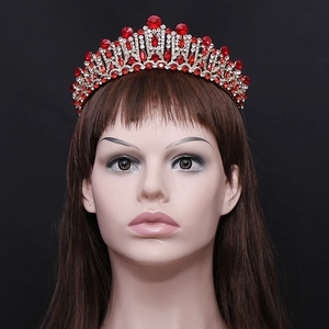 Baroque bridal crown with red and white crystals on a gold metal base for weddings
