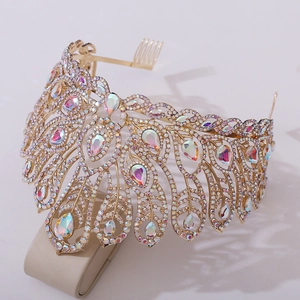Detailed macro view of sparkling gold pageant tiara with water-drop AB crystals and hair comb