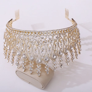 Detailed view of luxury baroque tiara featuring gold metal base and pear-shaped rhinestones