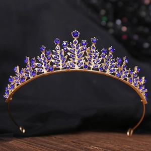 Detailed view of Baroque gold bridal crown featuring deep blue crystal rhinestones