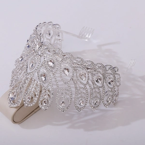 Detailed side view of silver peacock feather crown with crystals and side combs