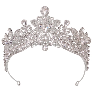 Detailed macro view of bridal alloy crown with floral patterns and sparkling rhinestones