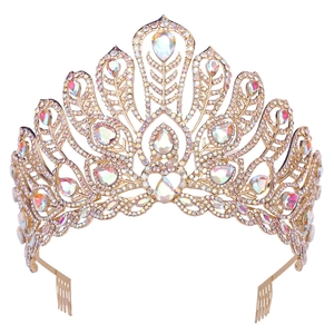 Detailed side view of golden pageant crown with AB crystal teardrop gems and hair combs
