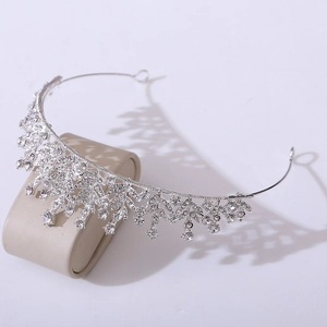 Close-up of elegant silver crystal bridal crown with sparkling rhinestones on display