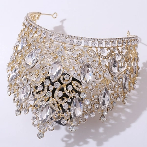 Detailed close-up of luxury Baroque gold crystal bridal tiara with intricate leaf design