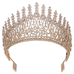 Detailed macro shot of baroque gold crown featuring intricate crystals and built-in hair comb