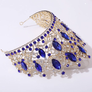 Detail of golden bridal tiara with luxury blue marquise crystals and white rhinestones