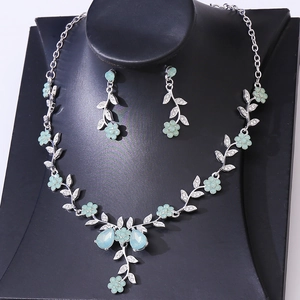 Exquisite silver bridal jewelry set with mint green rhinestone flower necklace and earrings