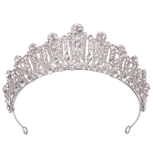 Baroque silver bridal crown with crystal rhinestones and teardrop pendants on white background