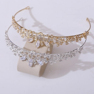 Elegant bridal tiara set with leaf motifs and sparkling cubic zirconia in gold and silver