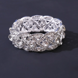 Macro shot of silver bridal bracelet with marquise rhinestones and hollow metal detail