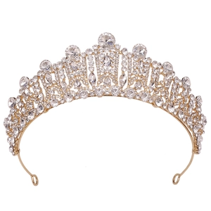 Detail of baroque bridal crown showing golden alloy frame and clear crystal rhinestones