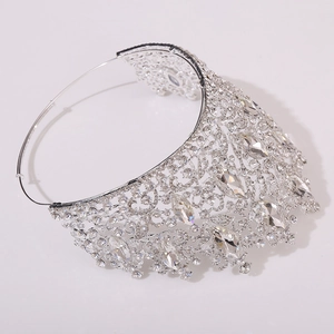 Detailed silver bridal crown with leaf patterns and shimmering crystal rhinestones